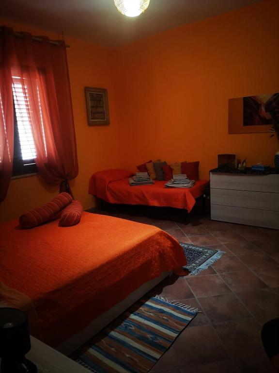 Posteľ alebo postele v izbe v ubytovaní OrangeBalestrate
