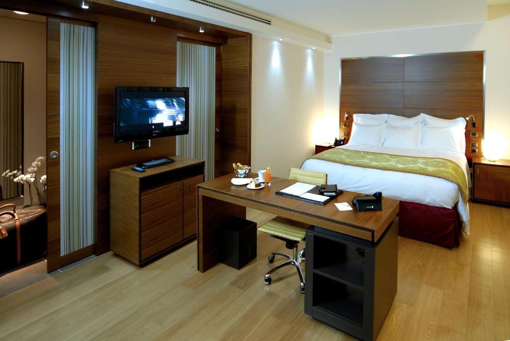Postel nebo postele na pokoji v ubytování Best Western Premier BHR Treviso Hotel