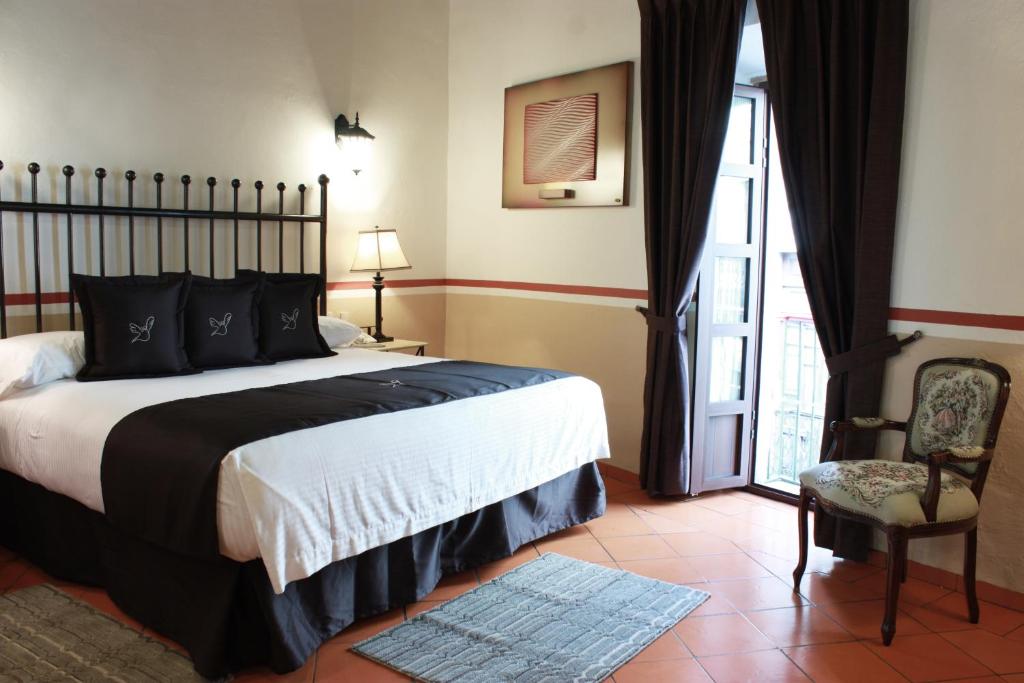 Postel nebo postele na pokoji v ubytování Hotel de la Paz