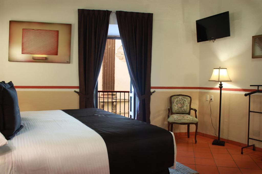 Postel nebo postele na pokoji v ubytování Hotel de la Paz