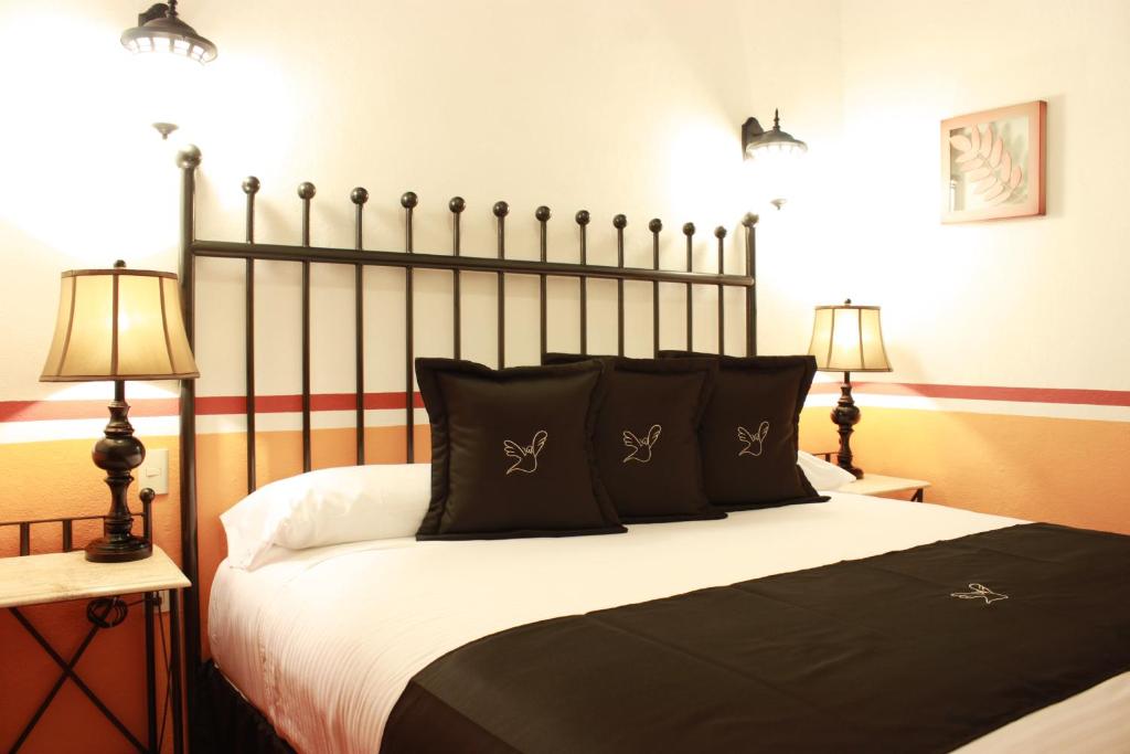 Postel nebo postele na pokoji v ubytování Hotel de la Paz