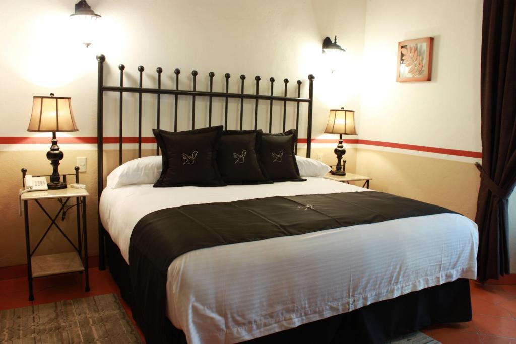 Postel nebo postele na pokoji v ubytování Hotel de la Paz