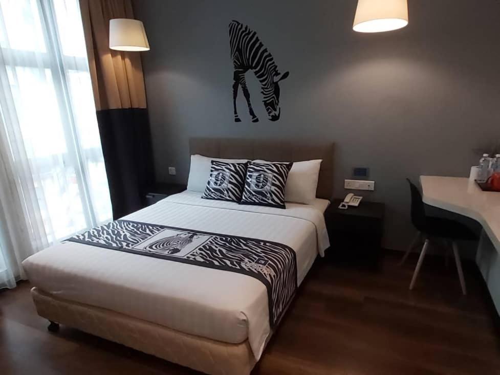 Postel nebo postele na pokoji v ubytování 9 Square Hotel - Subang