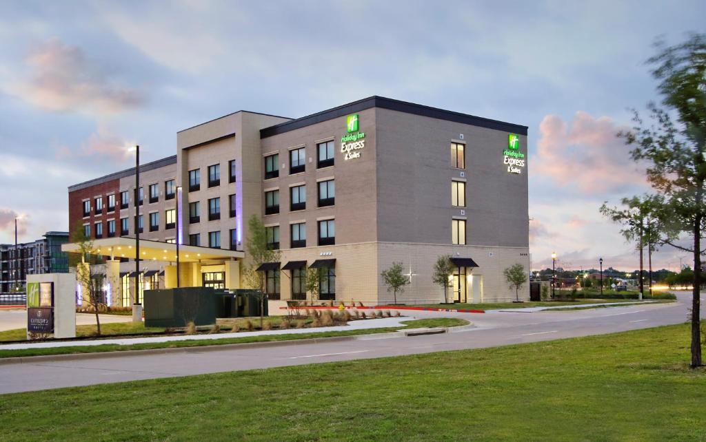 a large building on the side of a road at Holiday Inn Express & Suites Dallas Frisco NW Toyota Stdm, an IHG Hotel in Frisco