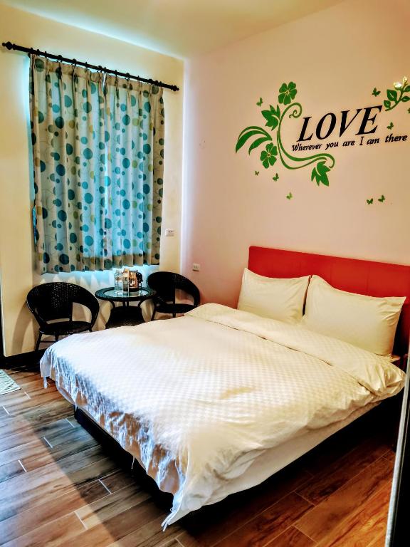 Postel nebo postele na pokoji v ubytování 池上投優榻 Smart living B&B