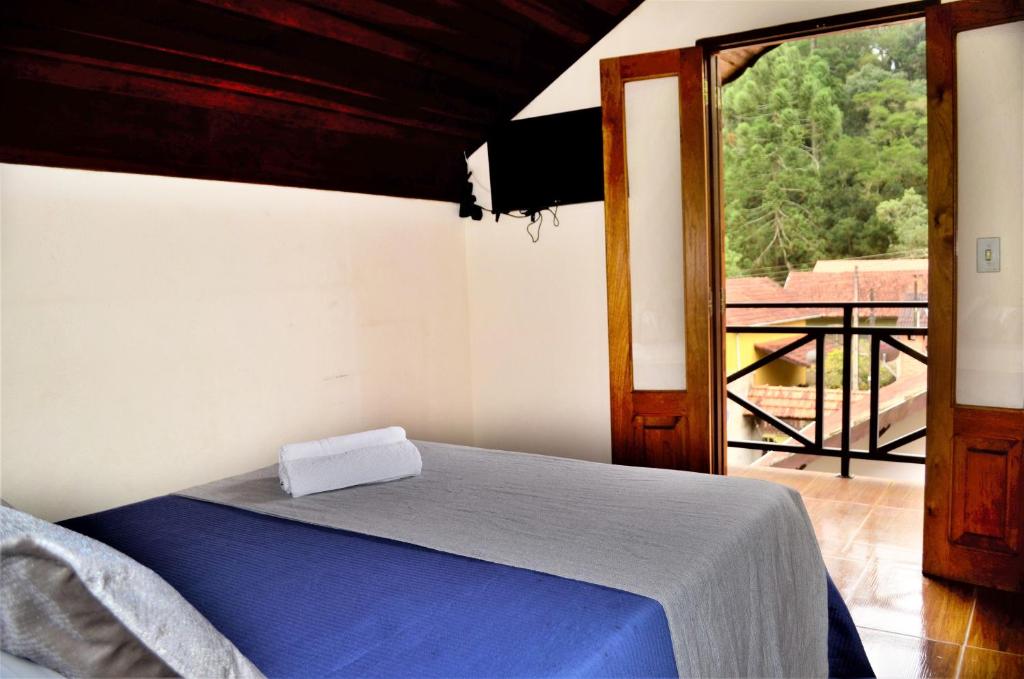 Säng eller sängar i ett rum på Casa Luz Serrana