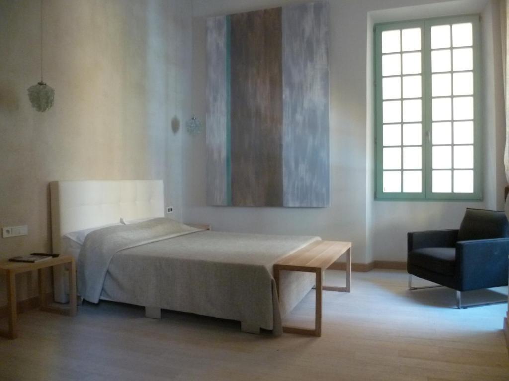 Postel nebo postele na pokoji v ubytování Hotel Rossetti