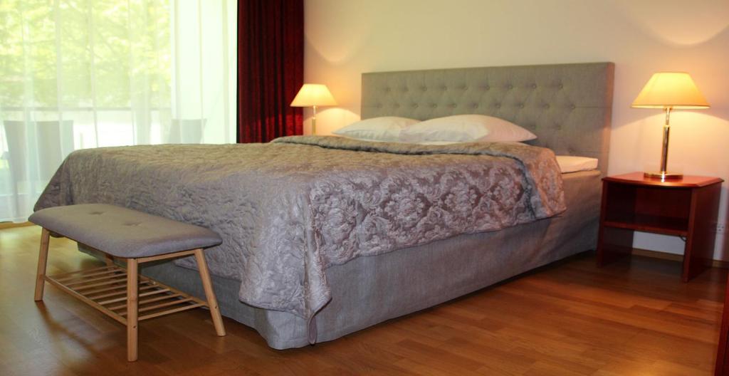 Postel nebo postele na pokoji v ubytování Seedri Residence
