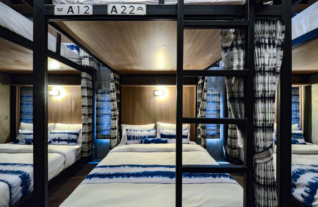 a bedroom with two bunk beds in a room at The Chic Lipe in Ko Lipe
