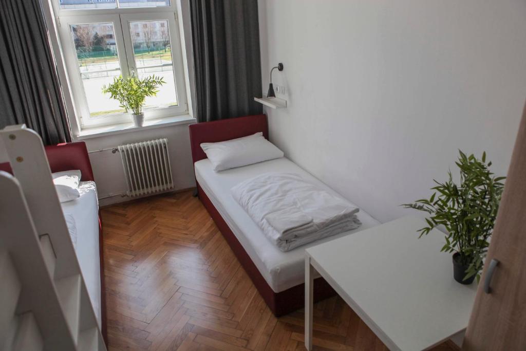 Postel nebo postele na pokoji v ubytování C - Punkt Hostel