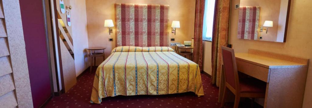 Postel nebo postele na pokoji v ubytování Hotel Atlantic