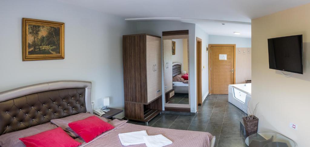 Postel nebo postele na pokoji v ubytování Hotel Bella Nella