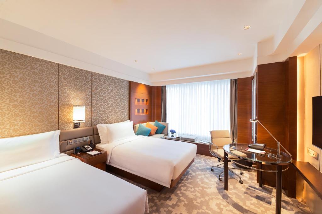 Postel nebo postele na pokoji v ubytování Crowne Plaza Macau by IHG