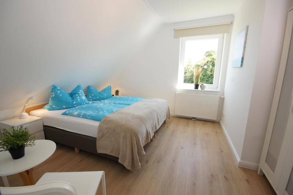 Postel nebo postele na pokoji v ubytování Ferienhaus II Wiesenblick