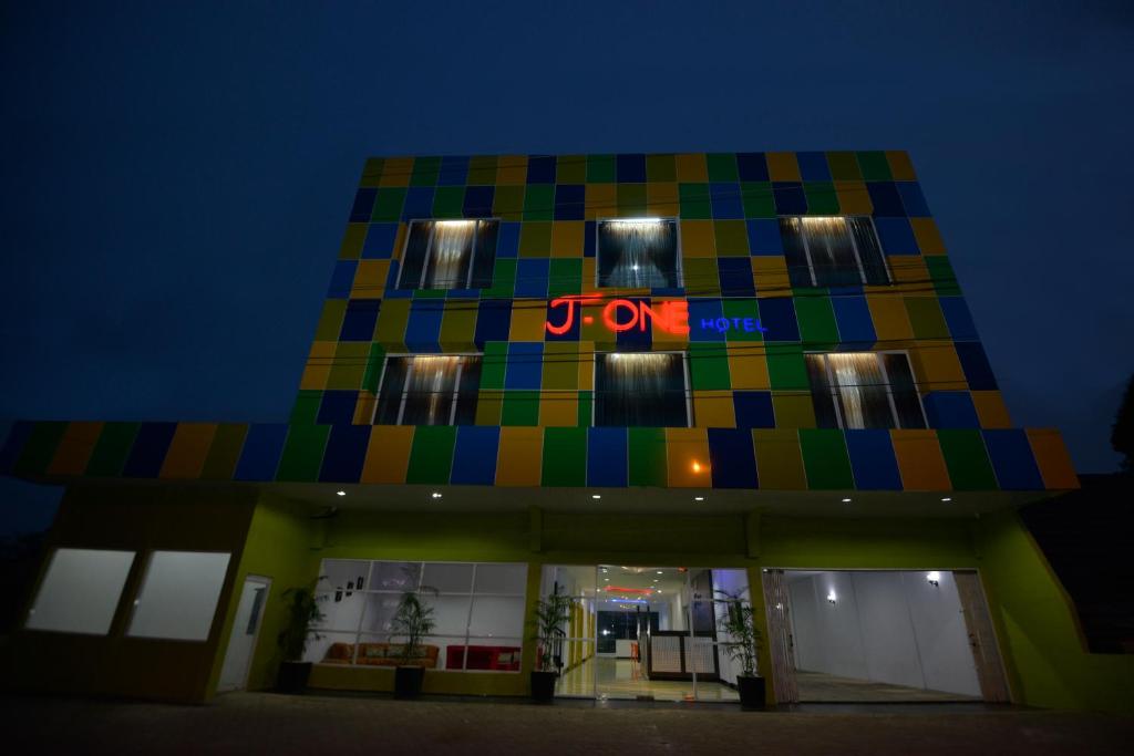 a colorful building with a dr pepper sign on it at T-ONE HOTEL in Tanjungjohor