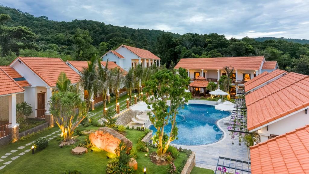 an aerial view of a house with a swimming pool at Bungalow Sáng Tươi Mountains in Phu Quoc