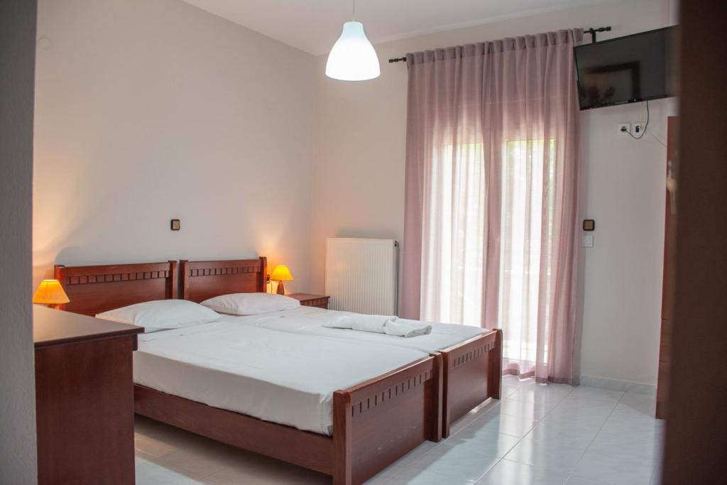 Postel nebo postele na pokoji v ubytování Mokos Rooms