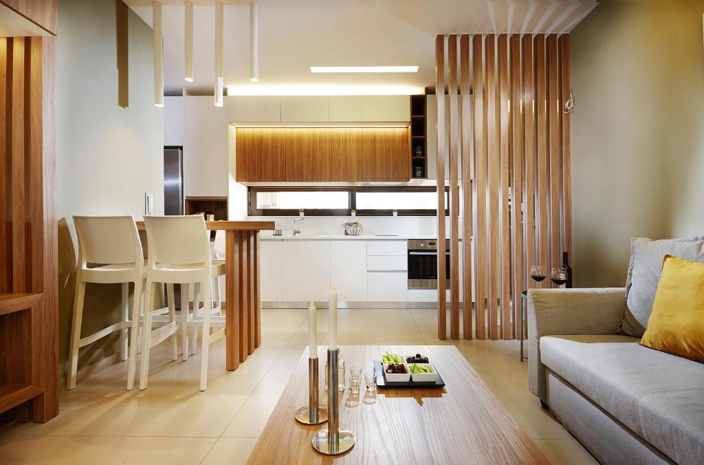 a living room with a couch and a table at Armi Luxury Apartment in the Heart of the City in Chania Town