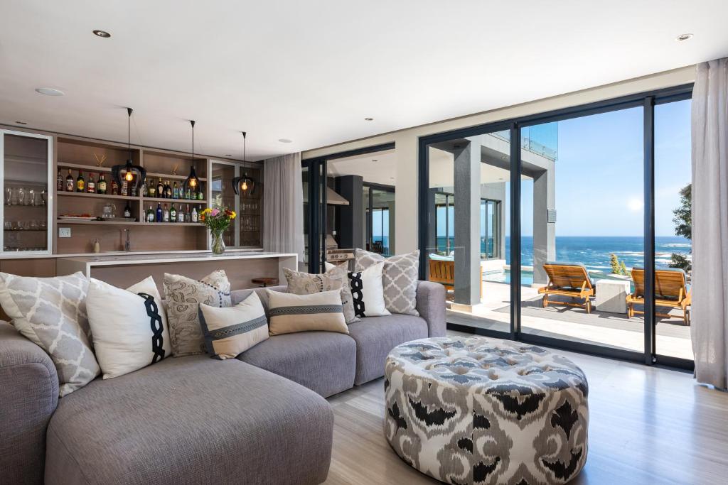 a living room with a couch and a table at Living Hotel Lion's Eye in Cape Town