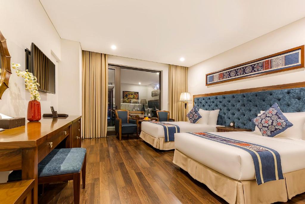 Postel nebo postele na pokoji v ubytování Balcona Hotel Da Nang