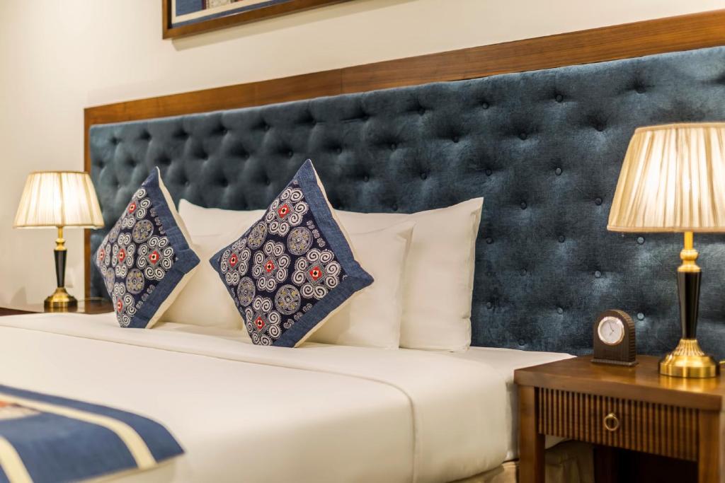 Postel nebo postele na pokoji v ubytování Balcona Hotel Da Nang