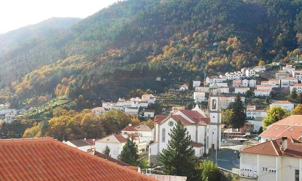 a view of a town with a mountain in the background at Charming house with mountain view in Manteigas, fireplace in Manteigas
