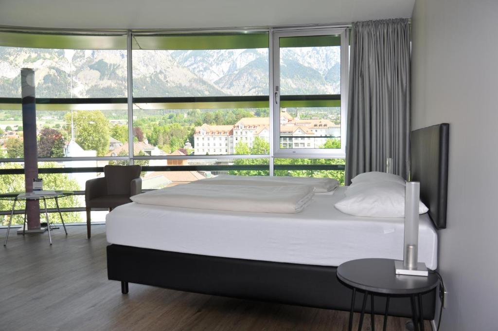 Postel nebo postele na pokoji v ubytování Parkhotel Hall in Tirol
