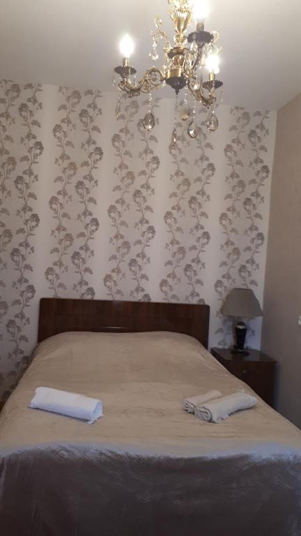 Postel nebo postele na pokoji v ubytování Guest House Gzirishvili