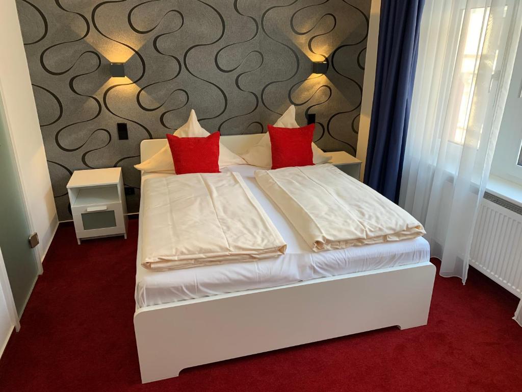 Postel nebo postele na pokoji v ubytování Hotel B54 Heidelberg City Center