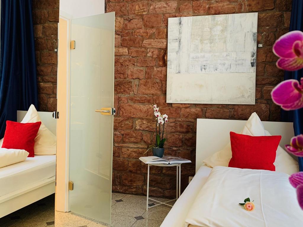 Postel nebo postele na pokoji v ubytování Hotel B54 Heidelberg City Center