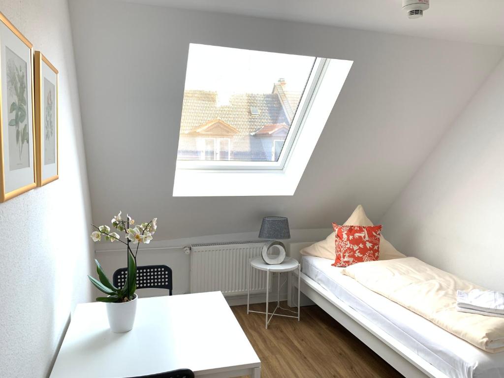 Postel nebo postele na pokoji v ubytování Hotel B54 Heidelberg City Center