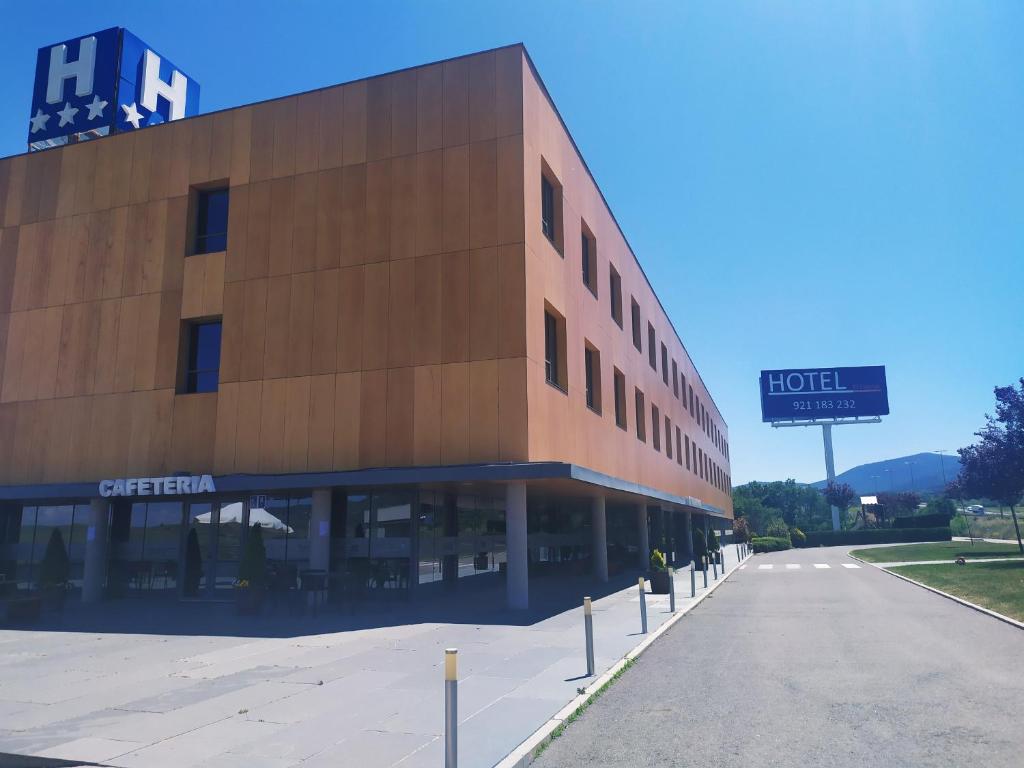 a building that has a sign on the side of it at El Espinar in El Espinar