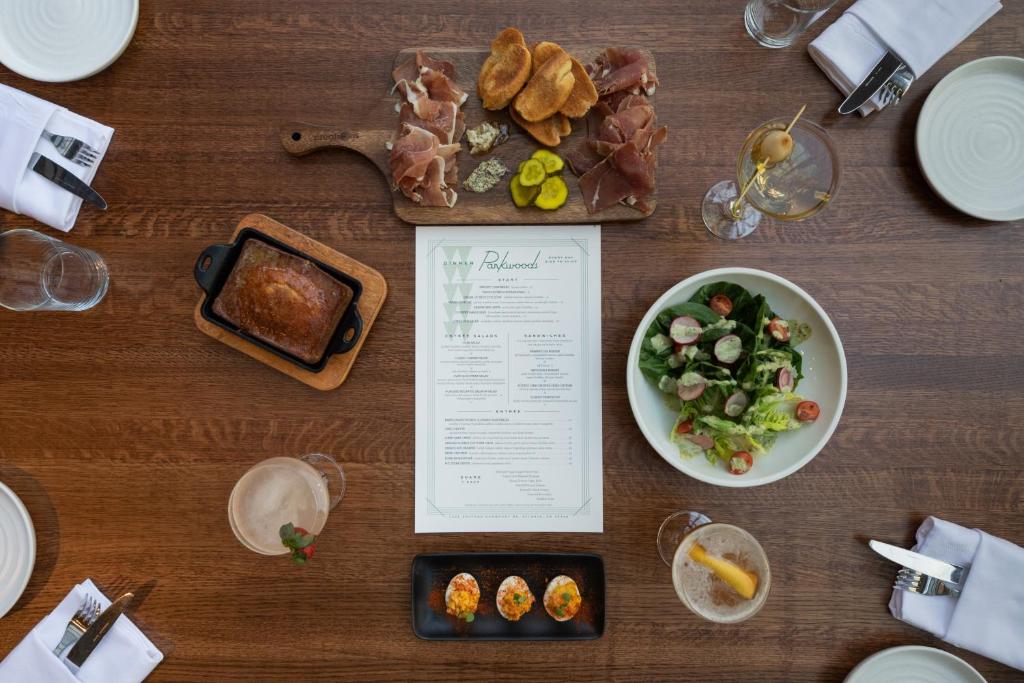 a table with a bowl of food and a plate of food at Crowne Plaza Atlanta Perimeter at Ravinia by IHG in Atlanta