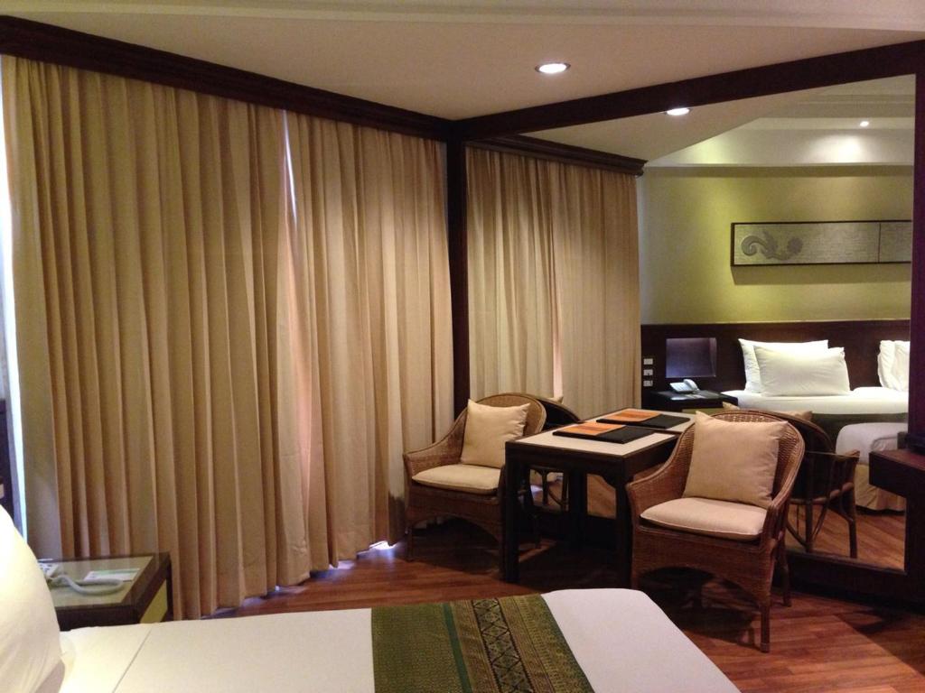 Uma cama ou camas num quarto em Wiang Inn Hotel