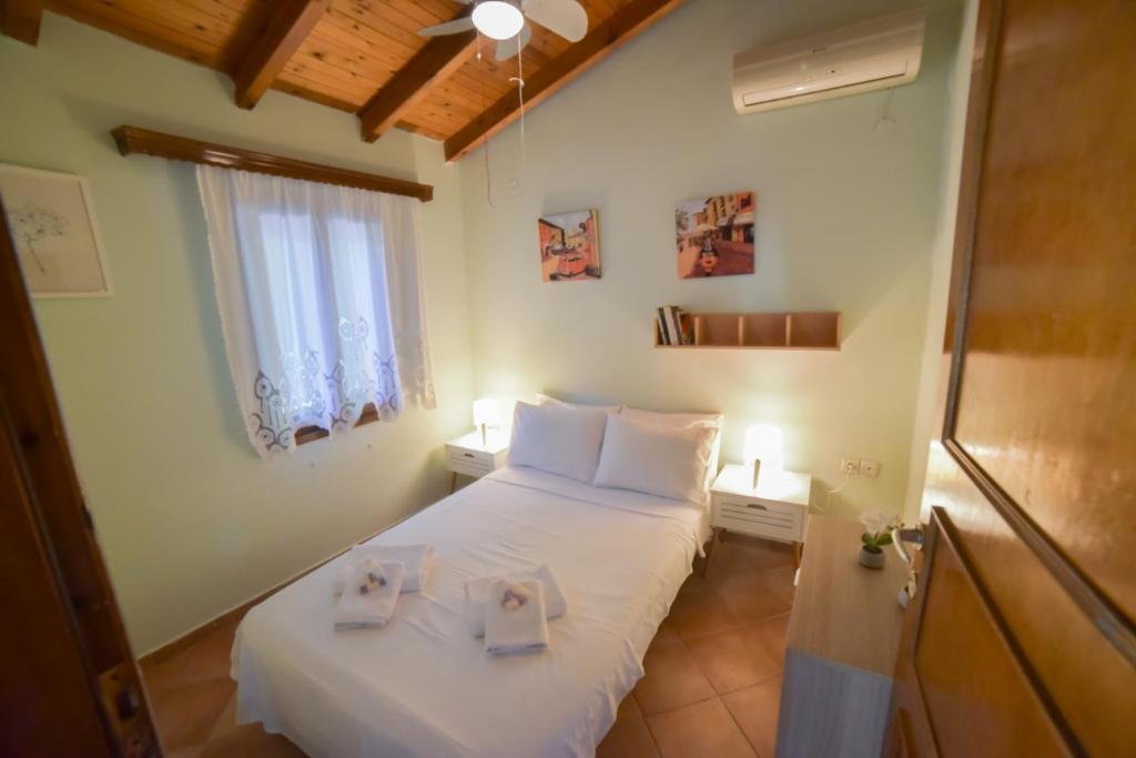 Postel nebo postele na pokoji v ubytování Villa Eva Halkidiki