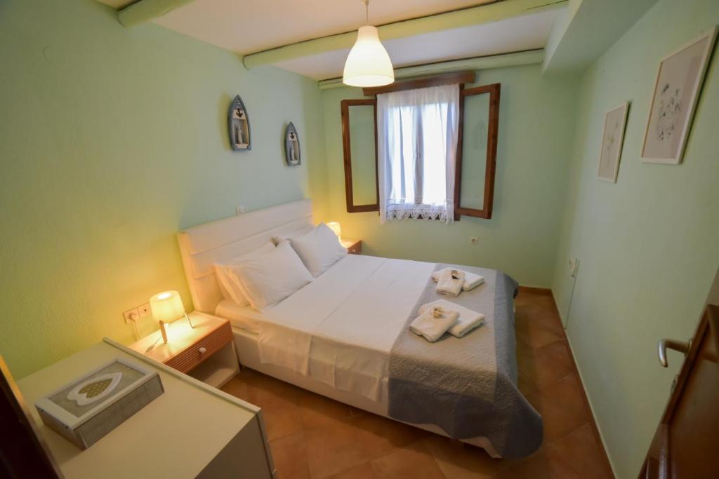 Postel nebo postele na pokoji v ubytování Villa Eva Halkidiki