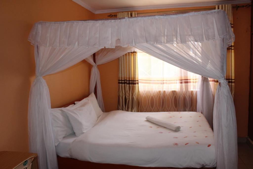 Postel nebo postele na pokoji v ubytování Salient Guest House