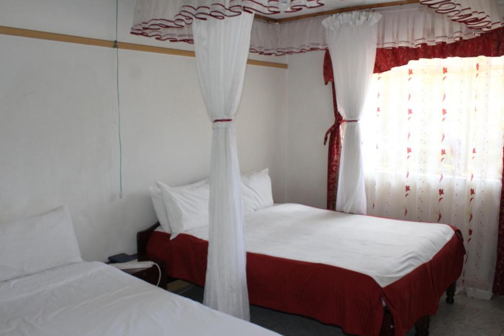 Postel nebo postele na pokoji v ubytování Salient Guest House