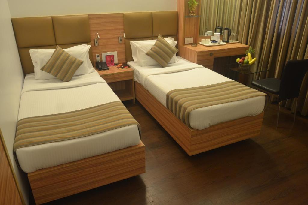 Postel nebo postele na pokoji v ubytování Hotel Plaza