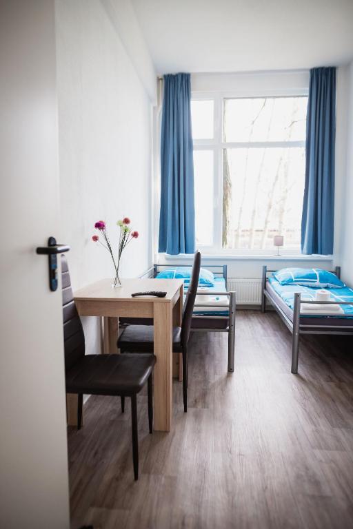 Postel nebo postele na pokoji v ubytování NeoHostel