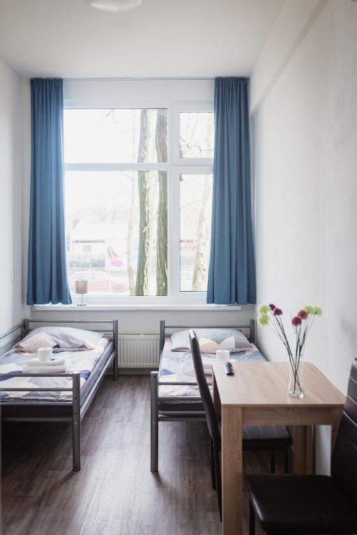 Postel nebo postele na pokoji v ubytování NeoHostel