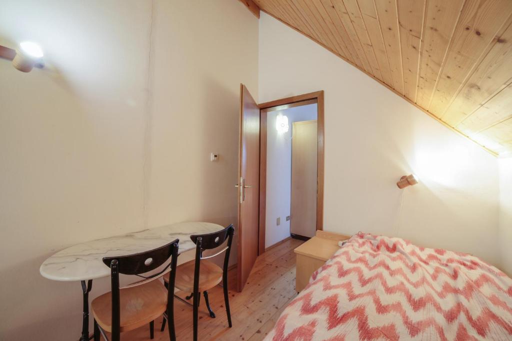 Postel nebo postele na pokoji v ubytování Maisonette Meraner Blick