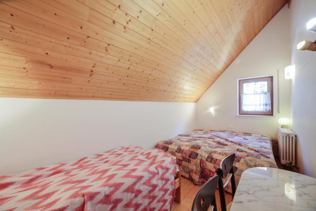 Postel nebo postele na pokoji v ubytování Maisonette Meraner Blick