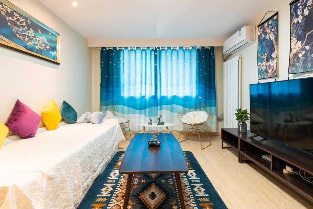 TV a/nebo společenská místnost v ubytování Yu Jing Xuan Boutique Apartment