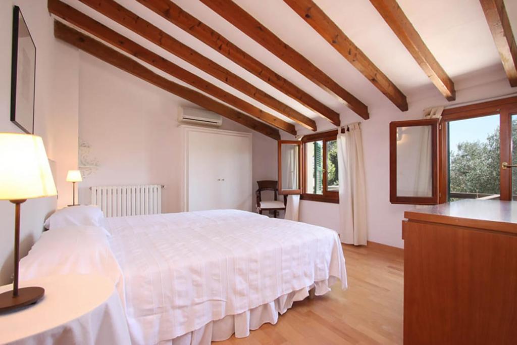 Postel nebo postele na pokoji v ubytování Villa Can Canaver