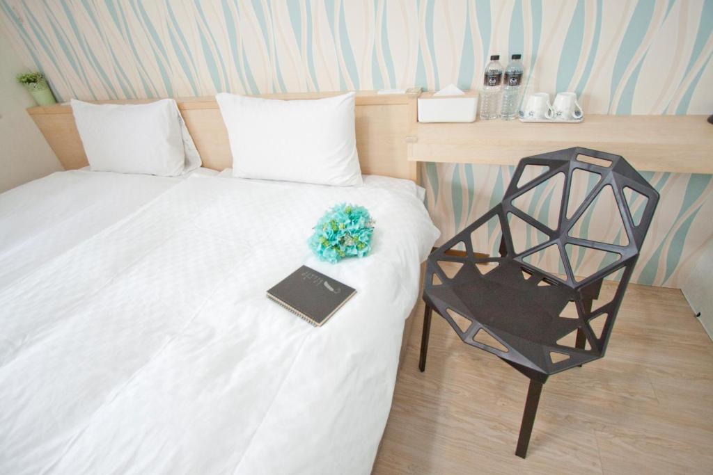 Postel nebo postele na pokoji v ubytování Dons Young Homestay