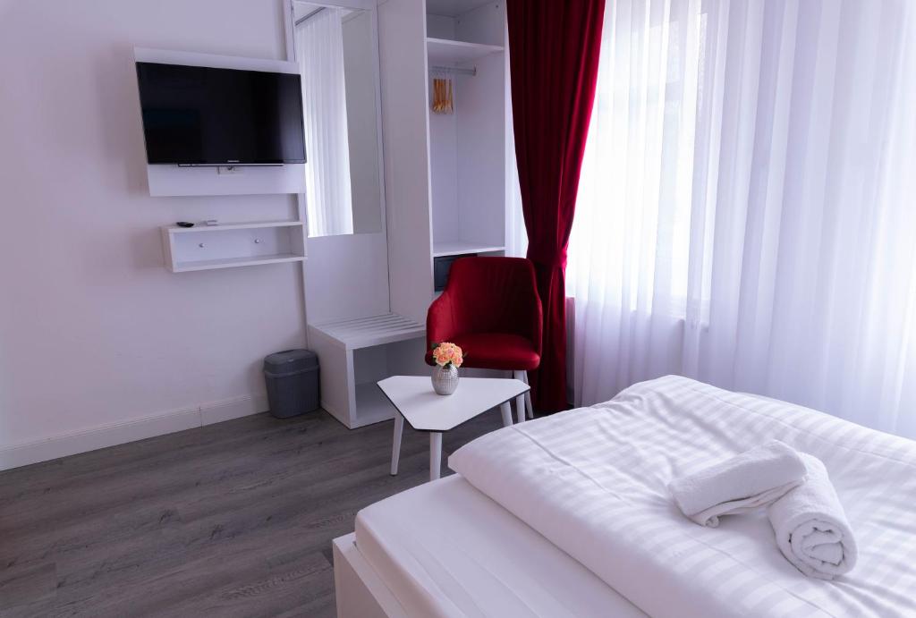 Postel nebo postele na pokoji v ubytování Heidepension Bispingen