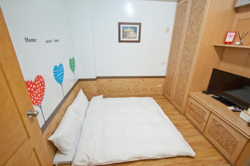 Postel nebo postele na pokoji v ubytování Dons Young Homestay