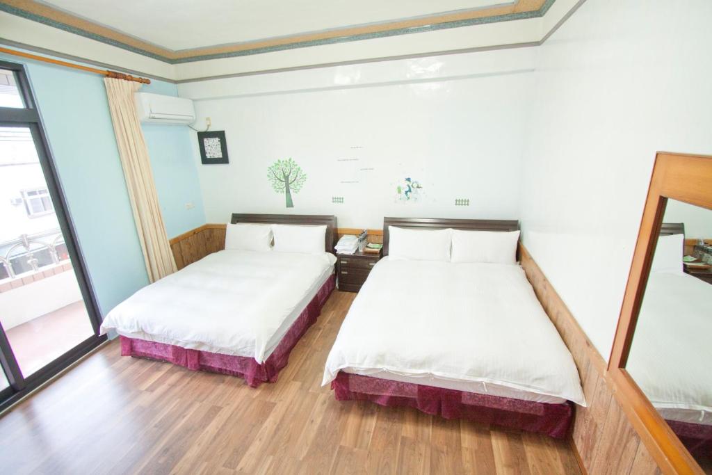 Postel nebo postele na pokoji v ubytování Dons Young Homestay