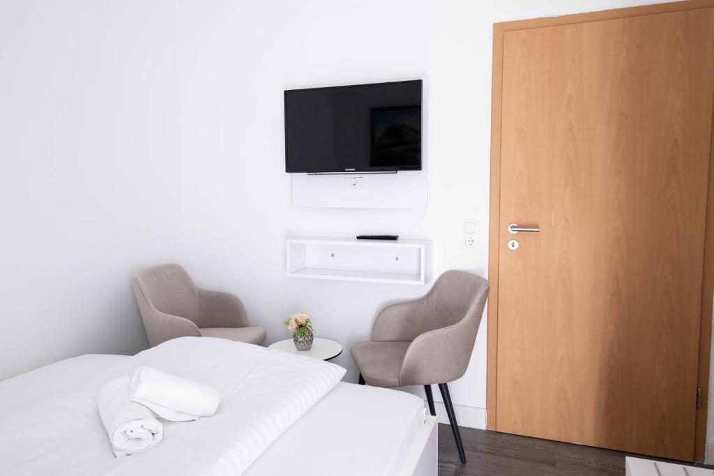 Postel nebo postele na pokoji v ubytování Heidepension Bispingen